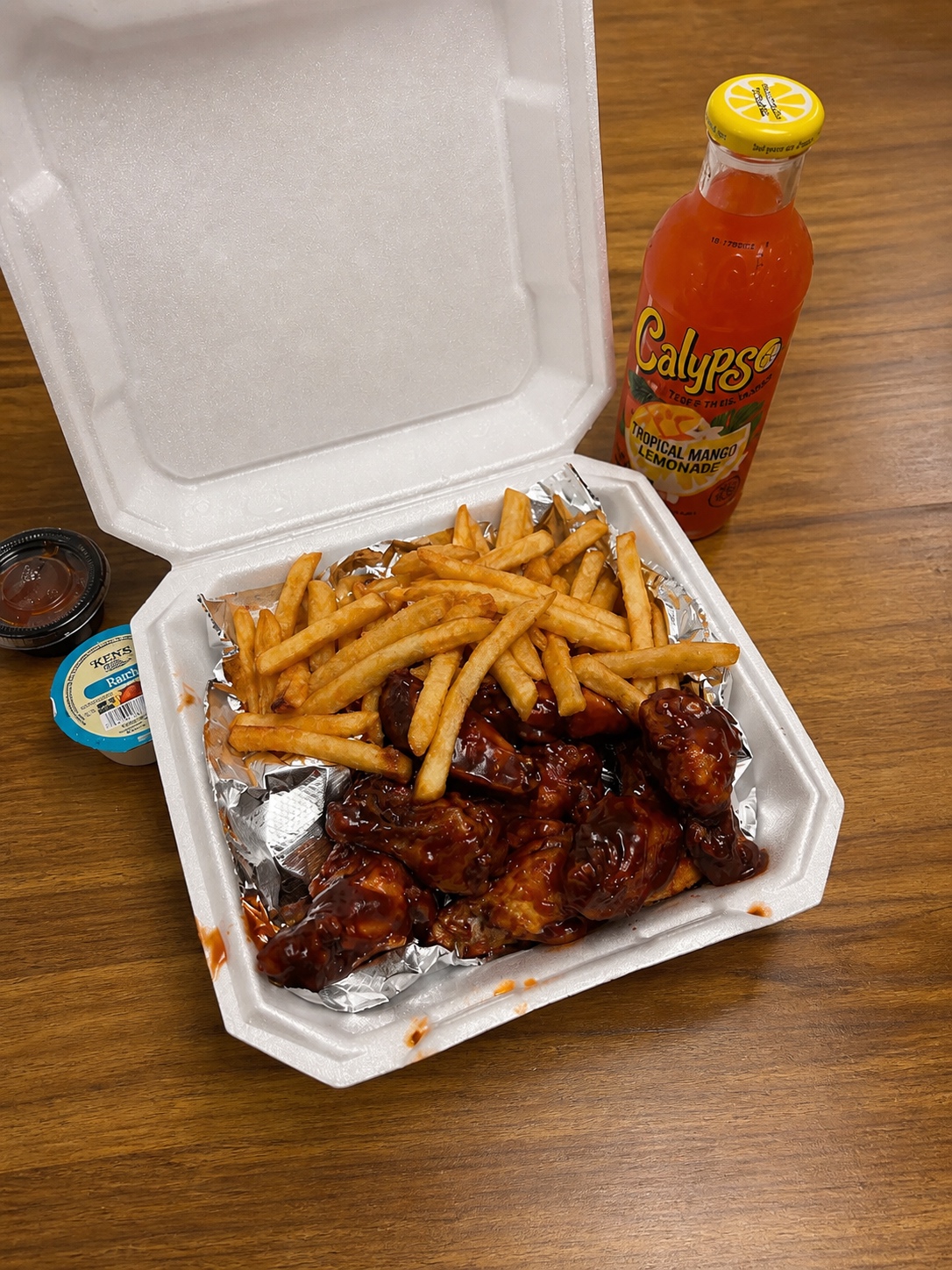Honey BBQ wings with fries and tropical lemonade